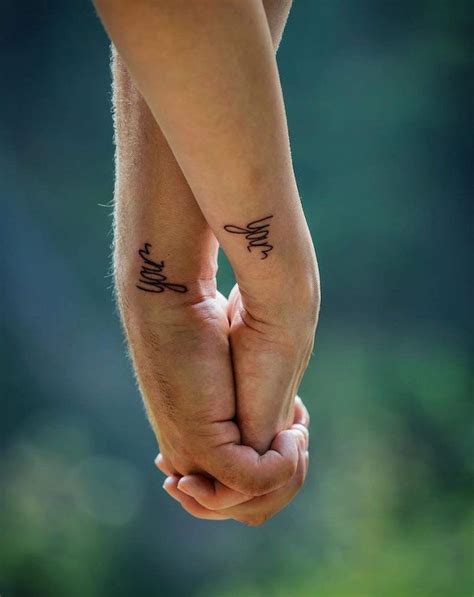 matching couples hand tattoos